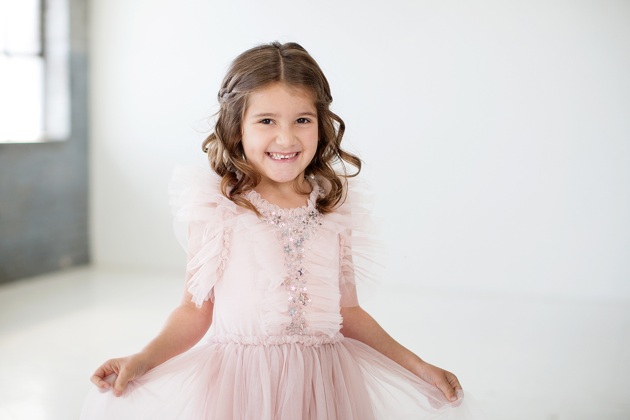 portrait of a little girl in a pink dress