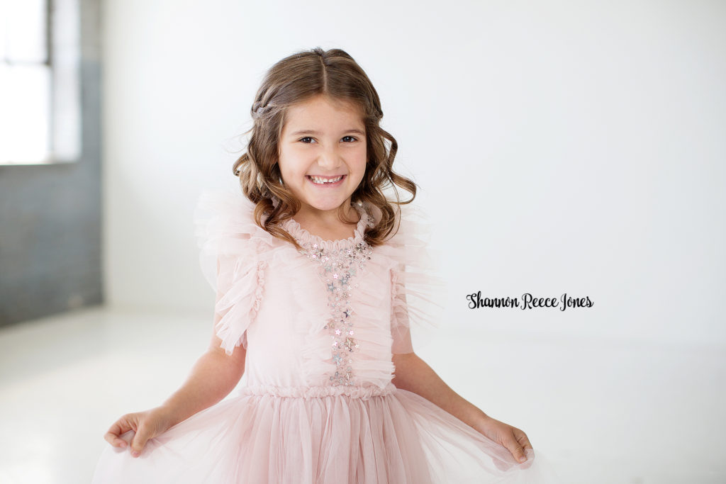 Little Girl in Pink Dress at Photography Studio