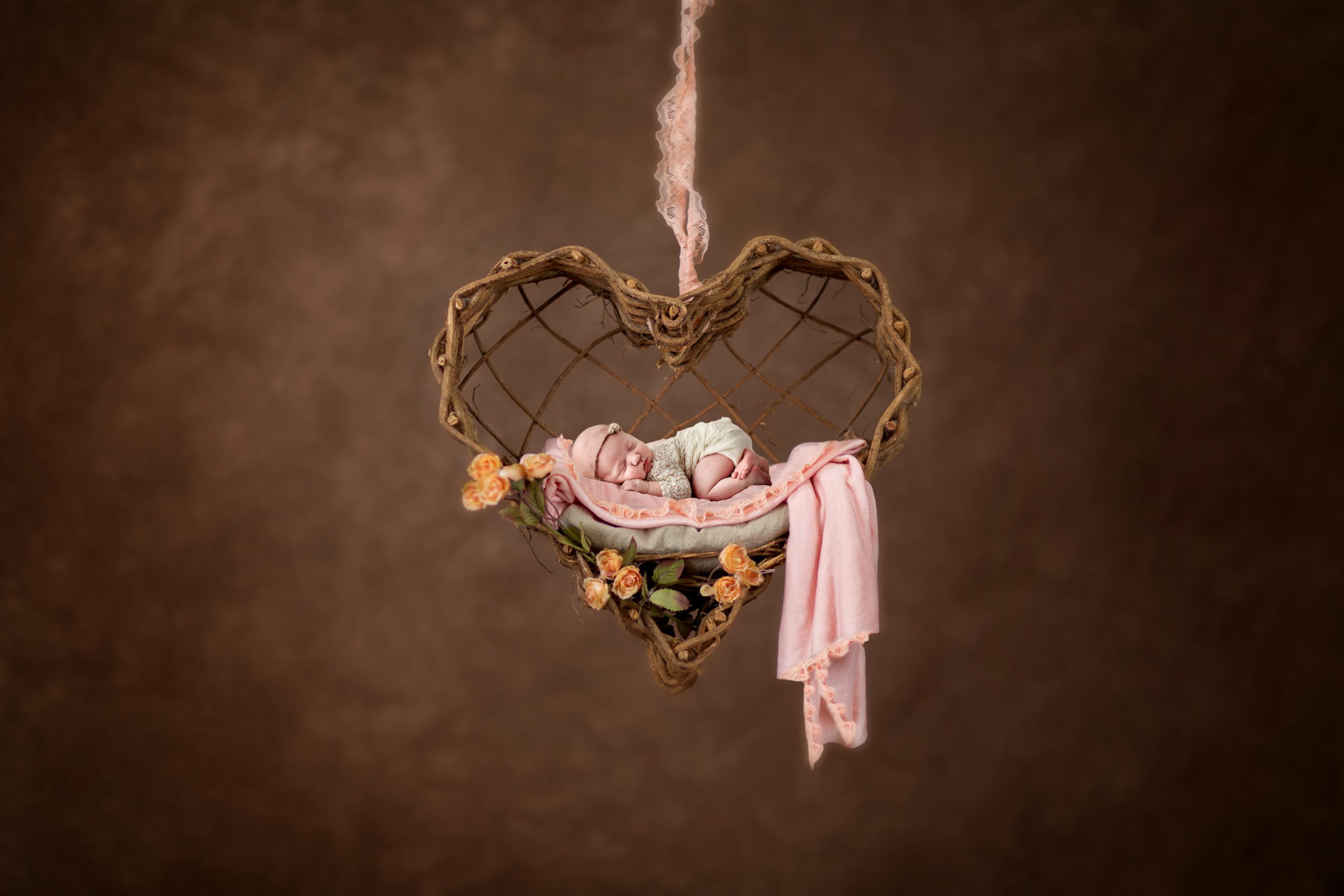 beautiful newborn photography texas, baby girl asleep in wicker heart swing