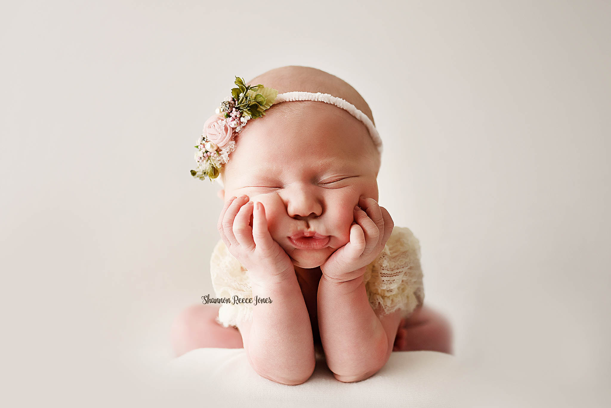 best newborn photographers texas, baby girl in froggy pose wearing floral headband