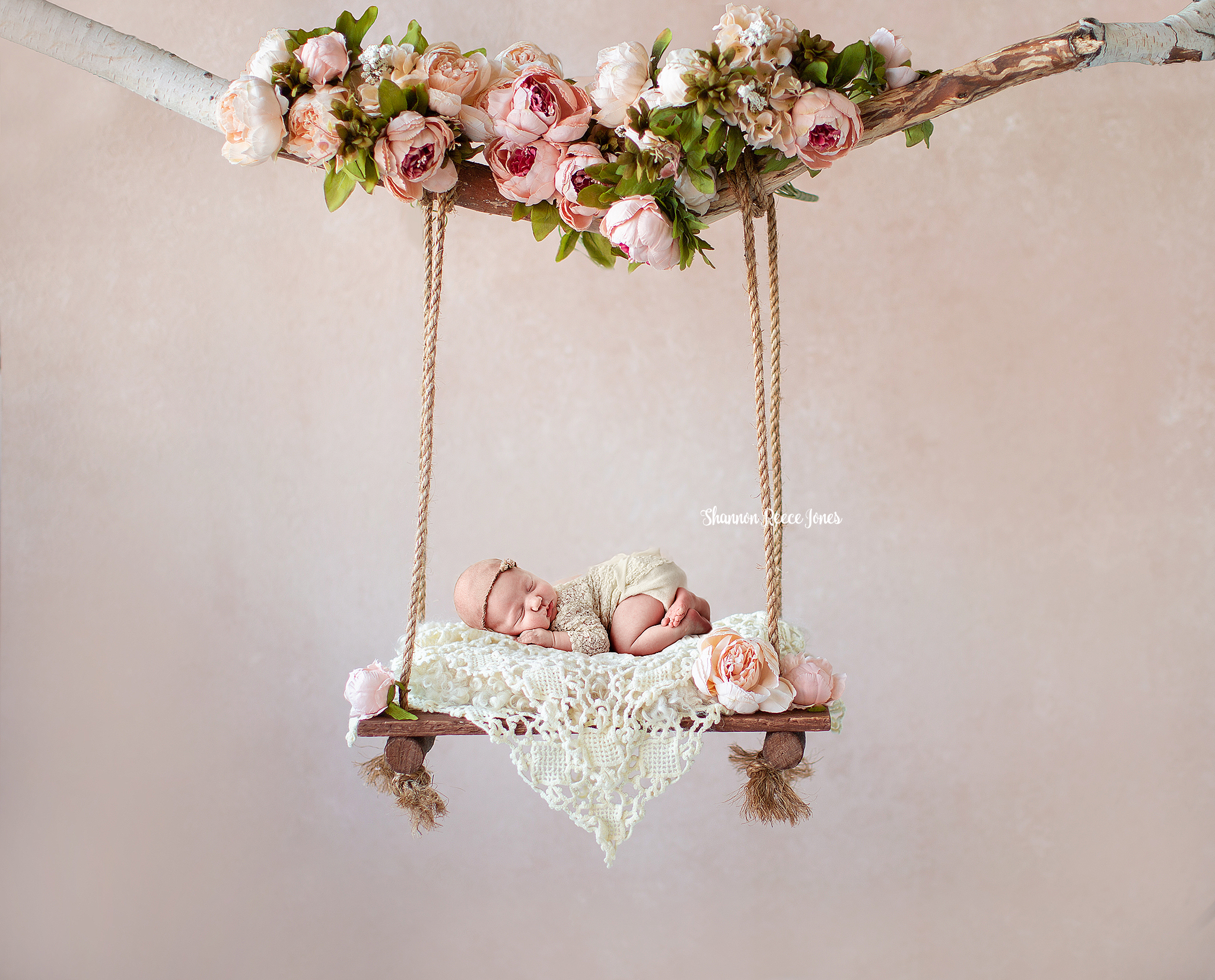 composite newborn photography, baby girl asleep in floral swing