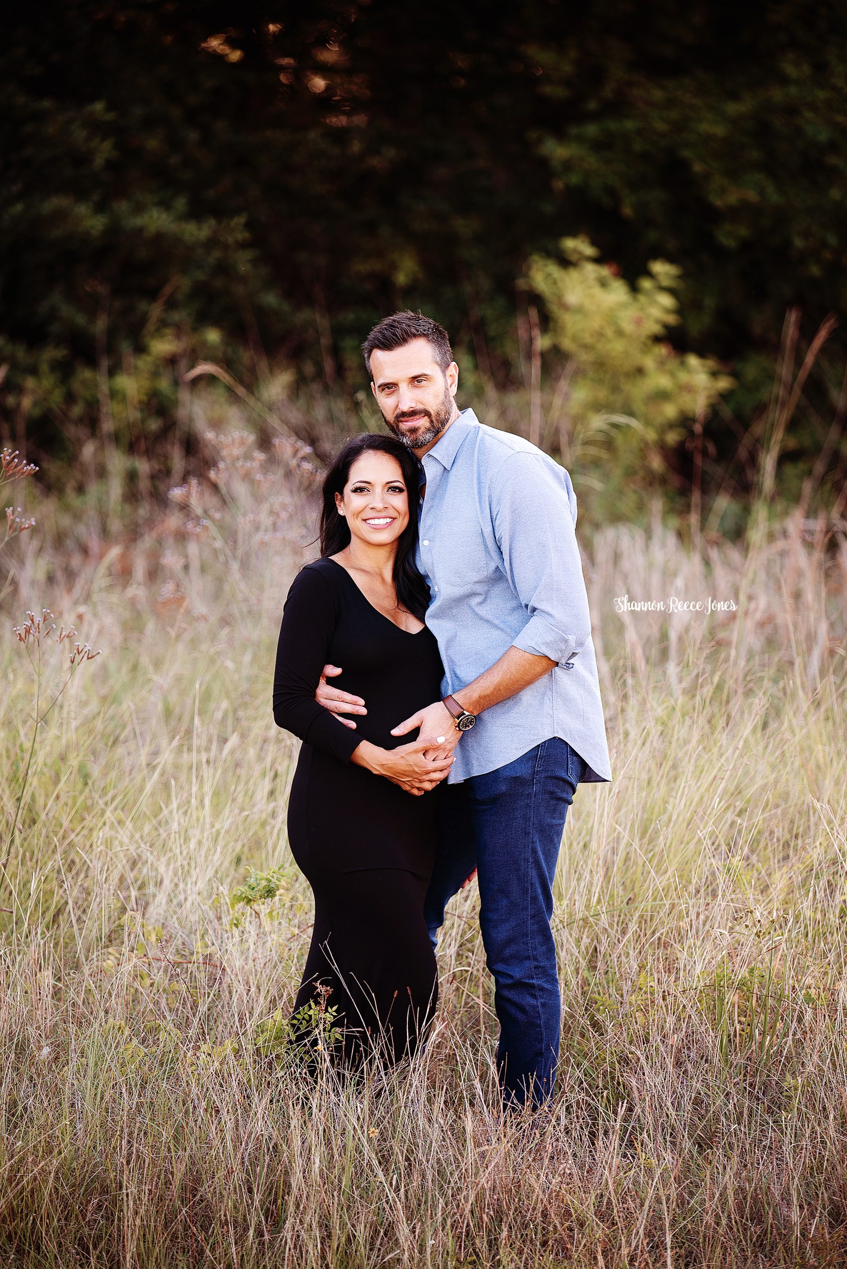 maternity photography, husband and wife standing in field