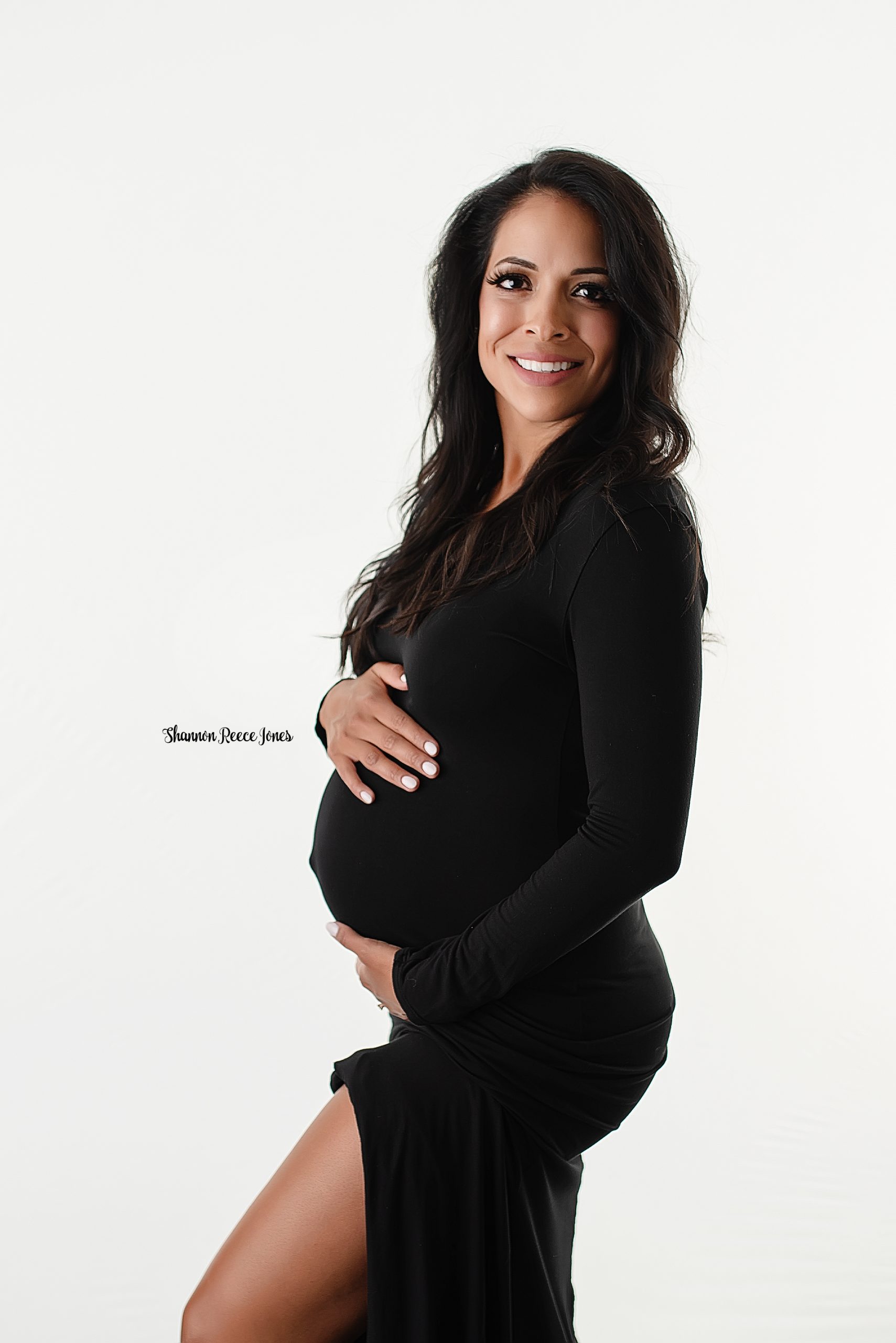 maternity photo shoot, pregnant woman in black dress