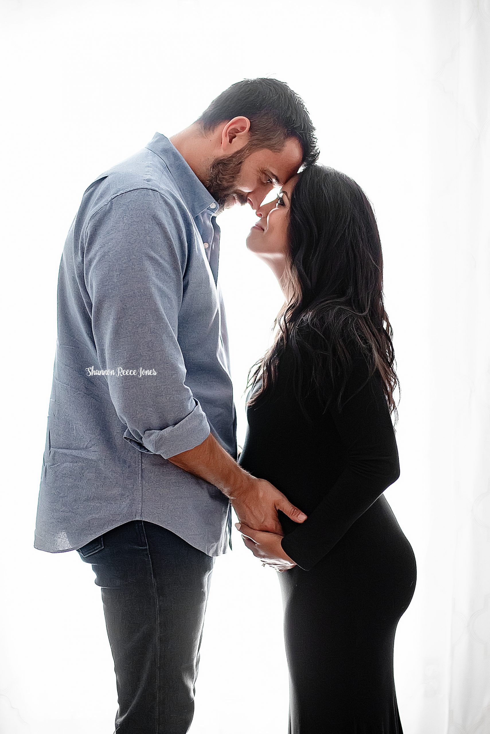 studio maternity photography texas, parents looking into each other's eyes