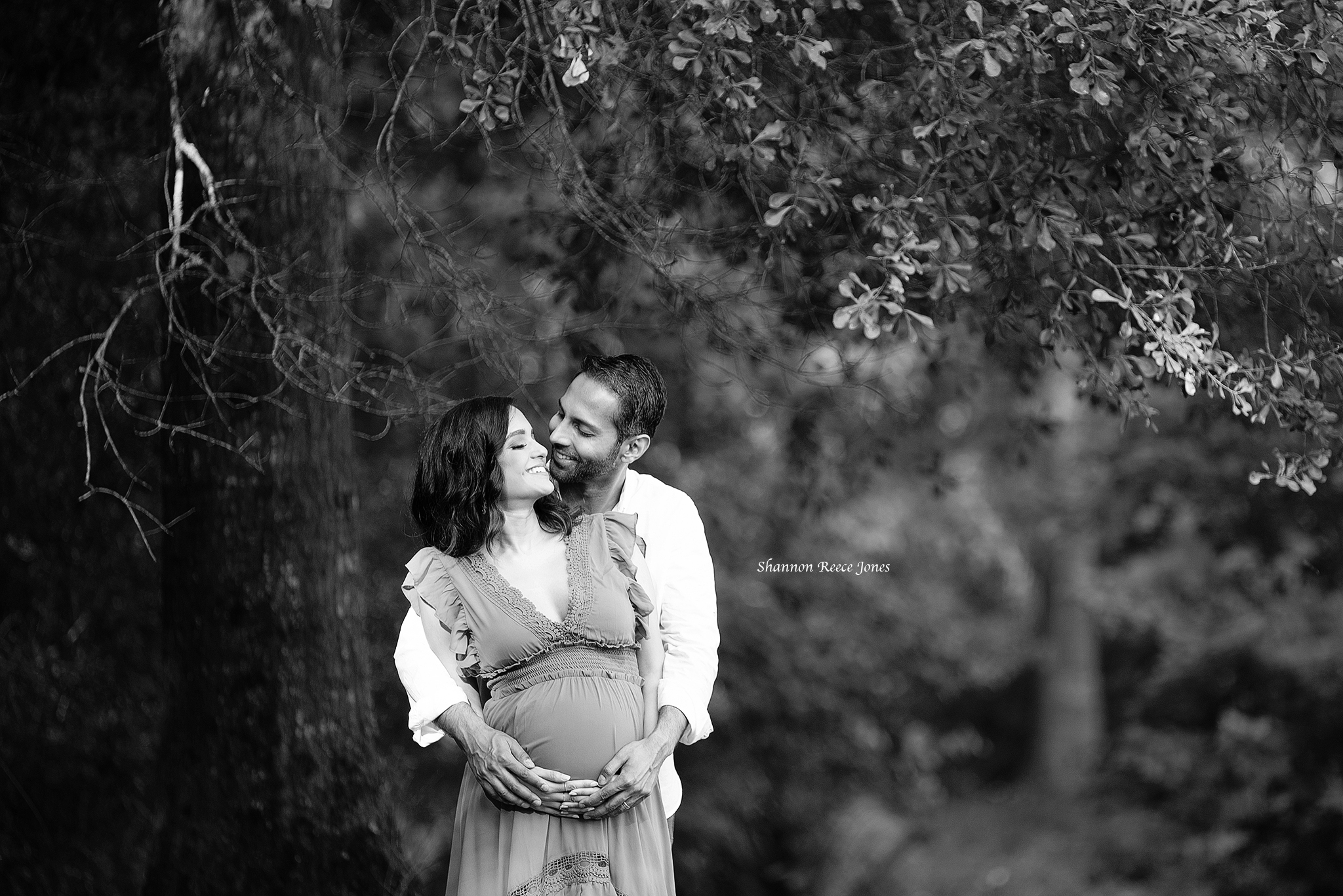 black and white image of pregnant woman and husband