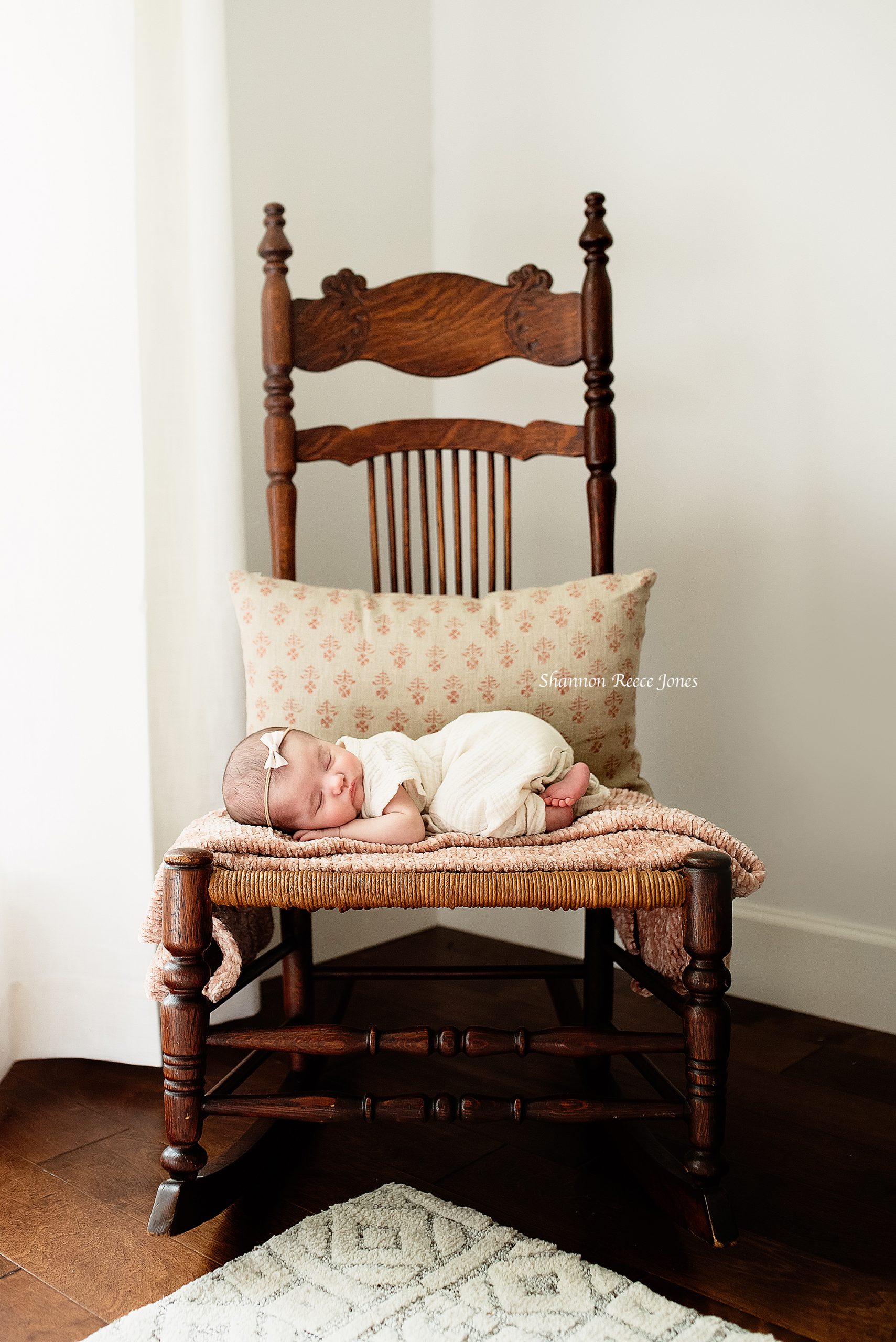 newborn asleep on rocking chair