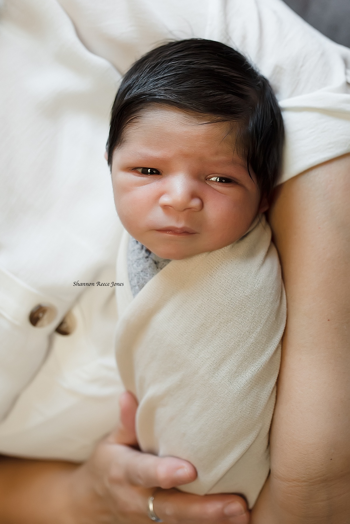 newborn lifestyle photographer texas, baby boy being held by grandmother