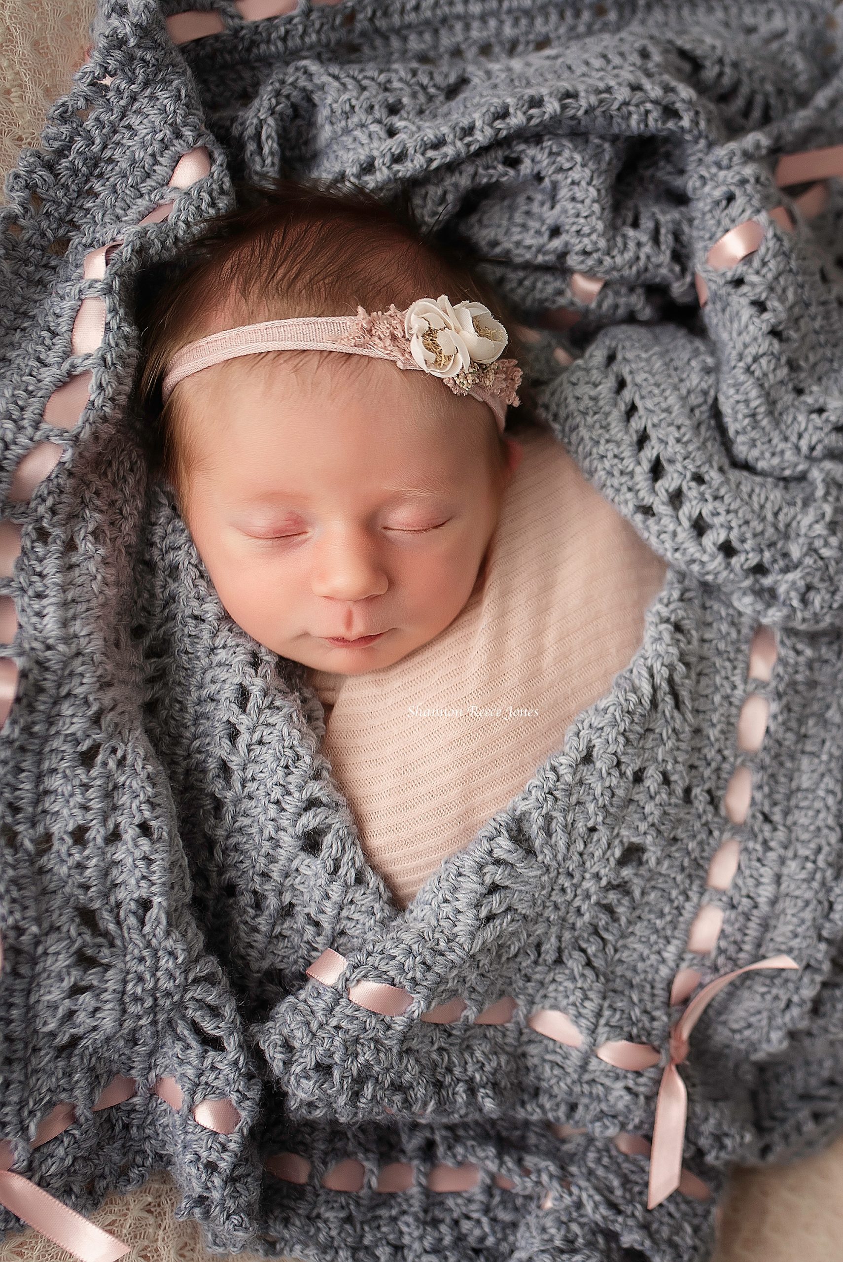 baby girl asleep in handmade blanket, Houston newborn photographer