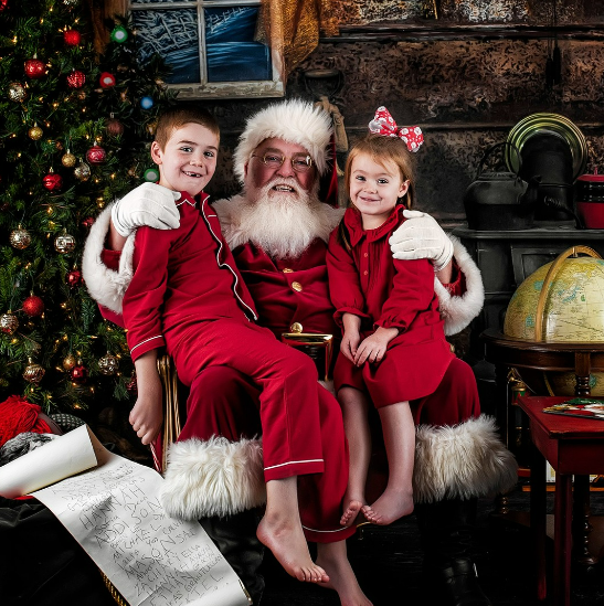 Christmas photo sessions with kids sitting on Santa's lap