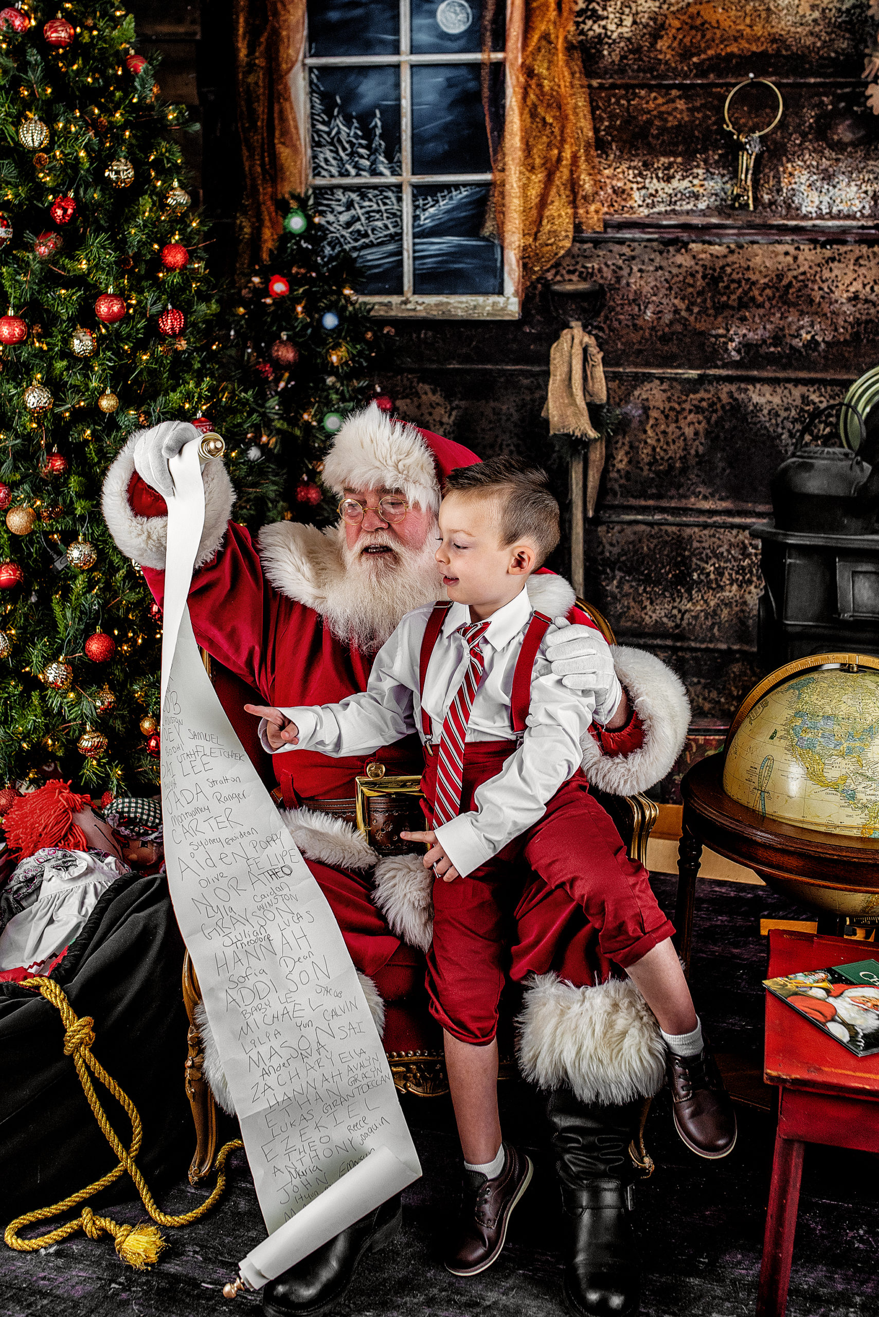 Santa and boy holding naughty and nice list