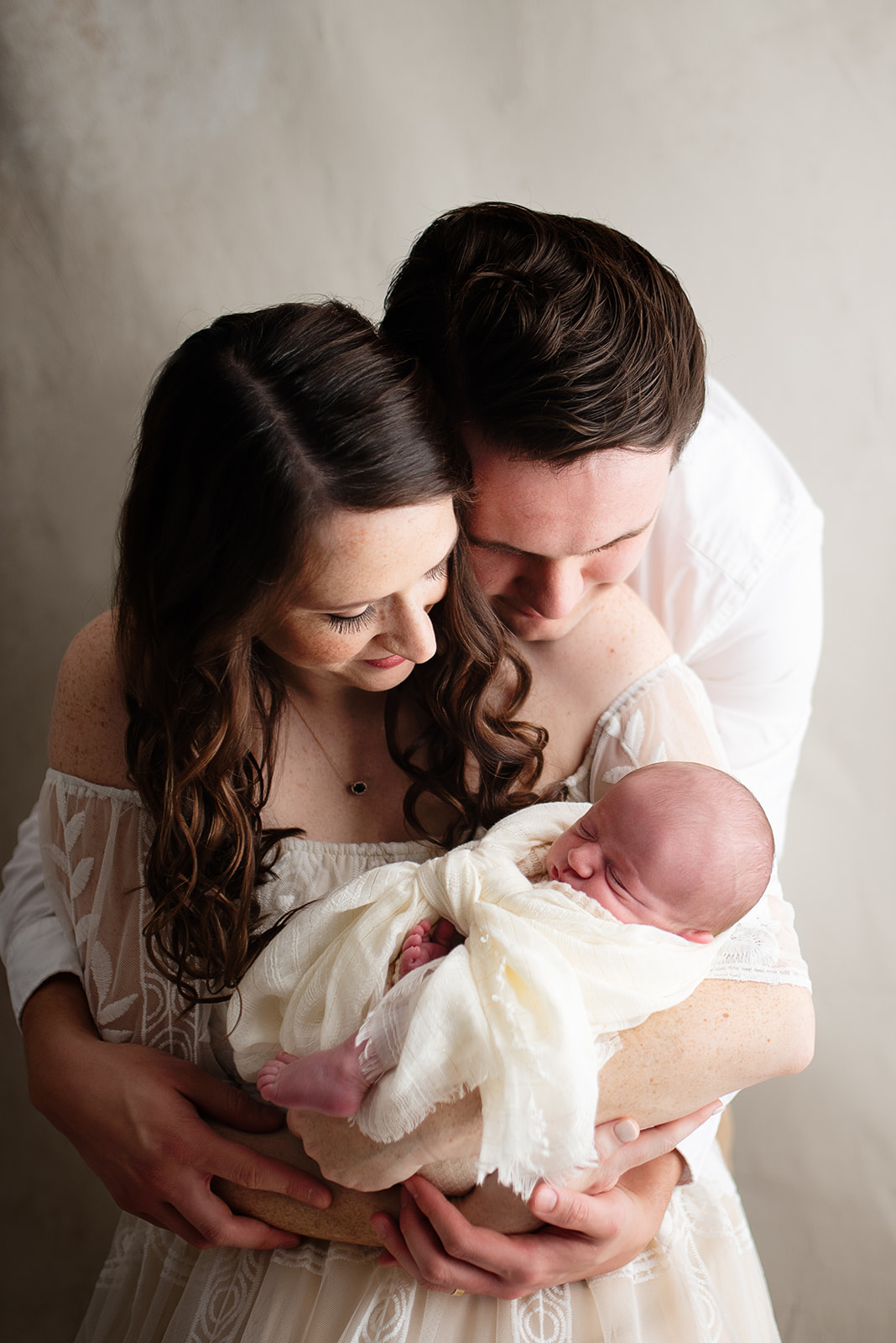 Houston newborn photography, parents bending over new baby boy
