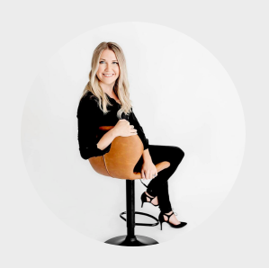 Hair and makeup stylist seated in a modern office swivel chair