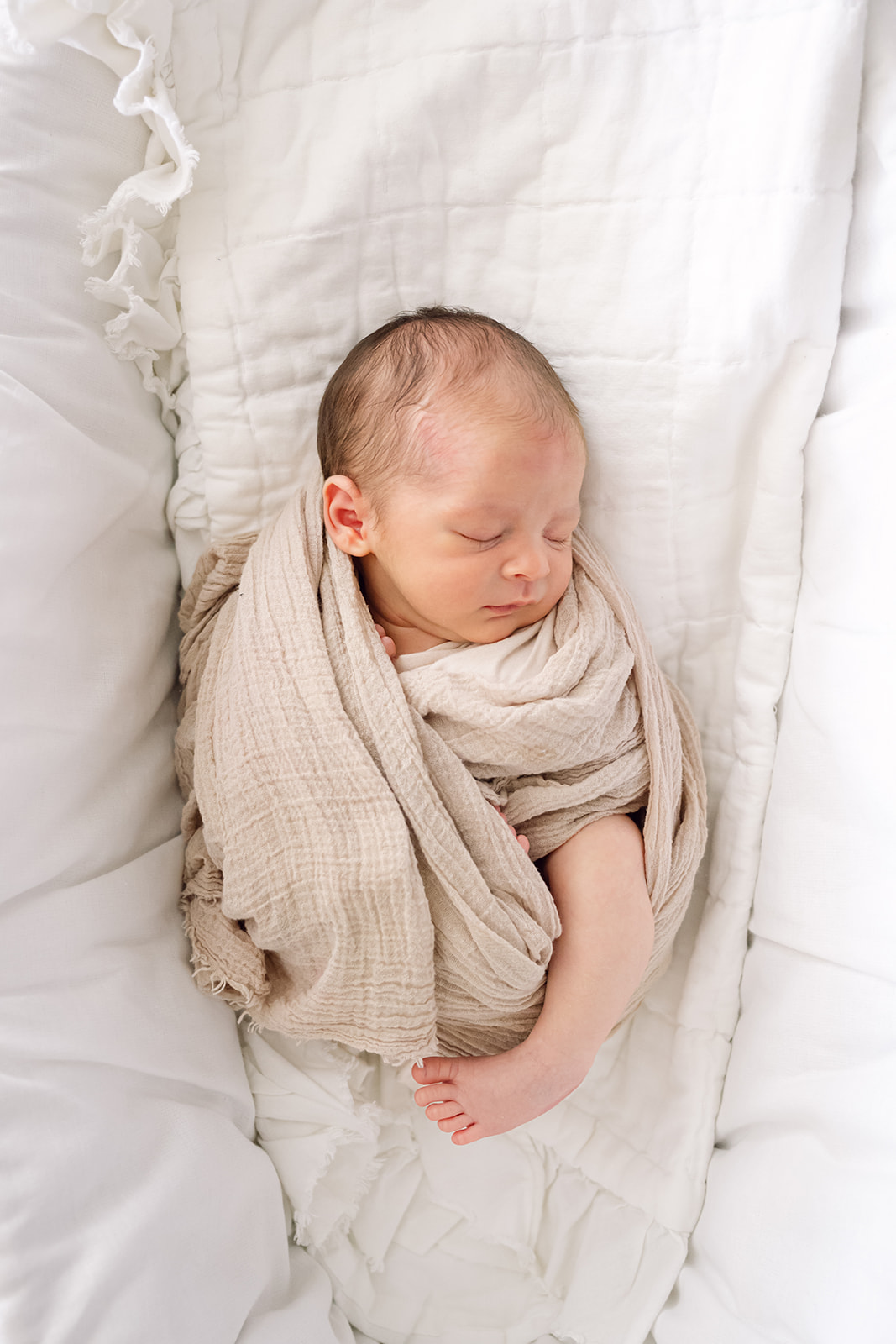 Houston newborn session at home - baby boy in newborn wrap during photo session