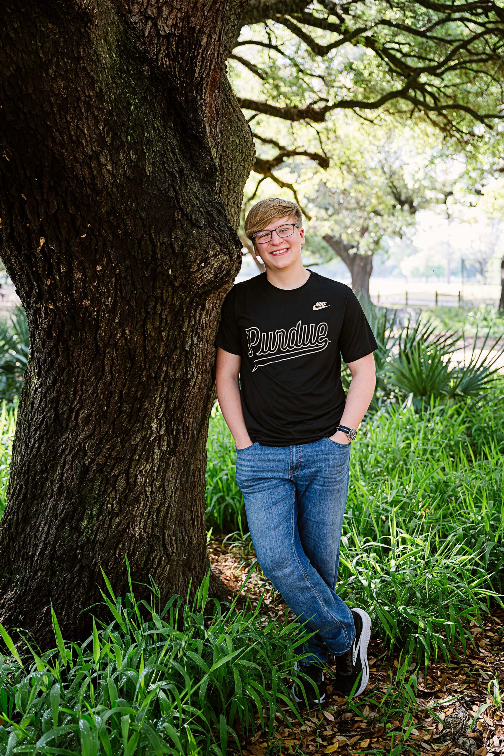 Houston senior photos at Hermann Park with natural light and greenery, Class of 2026 senior portrait